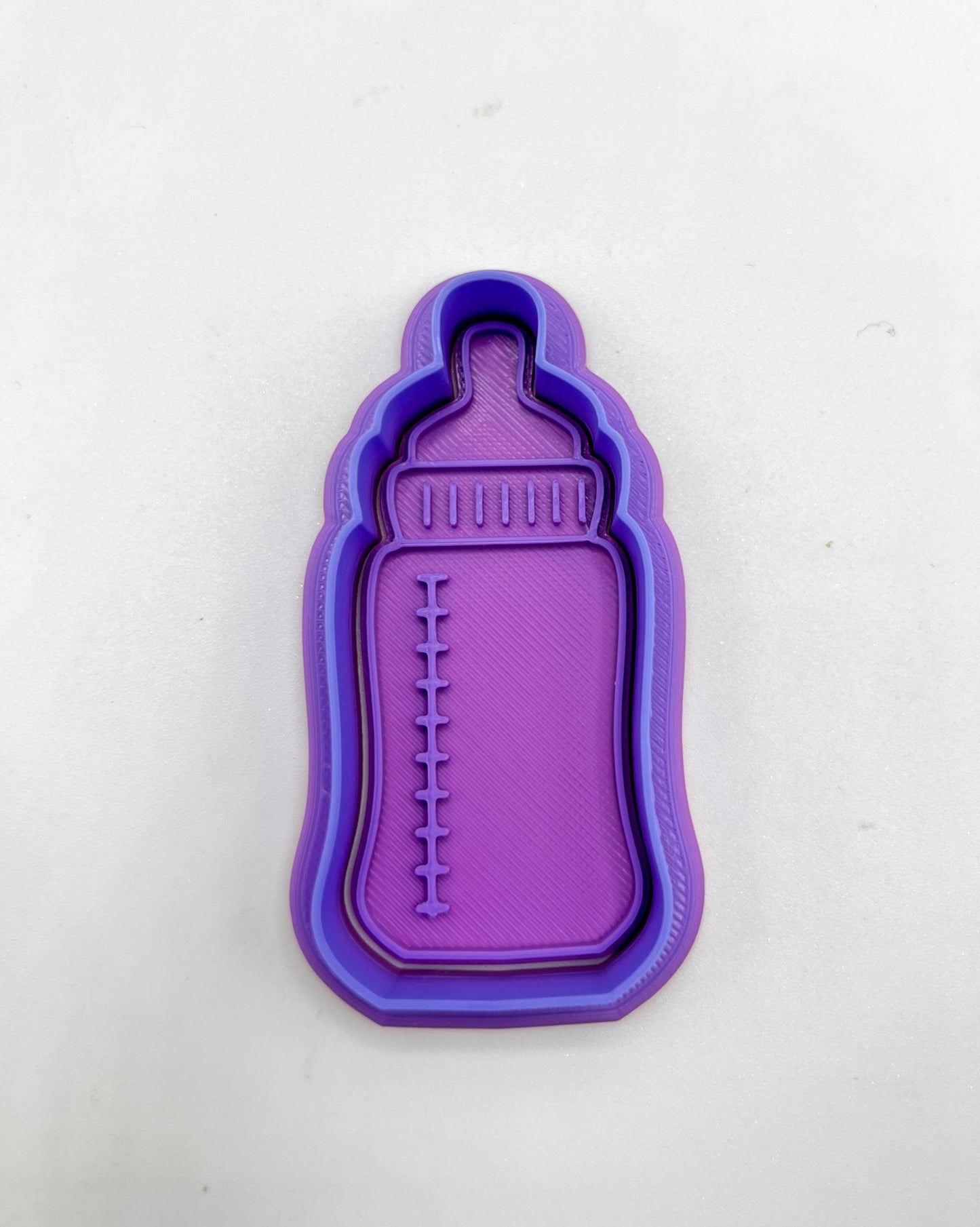 بزة
baby milk bottle cutter and stamp
