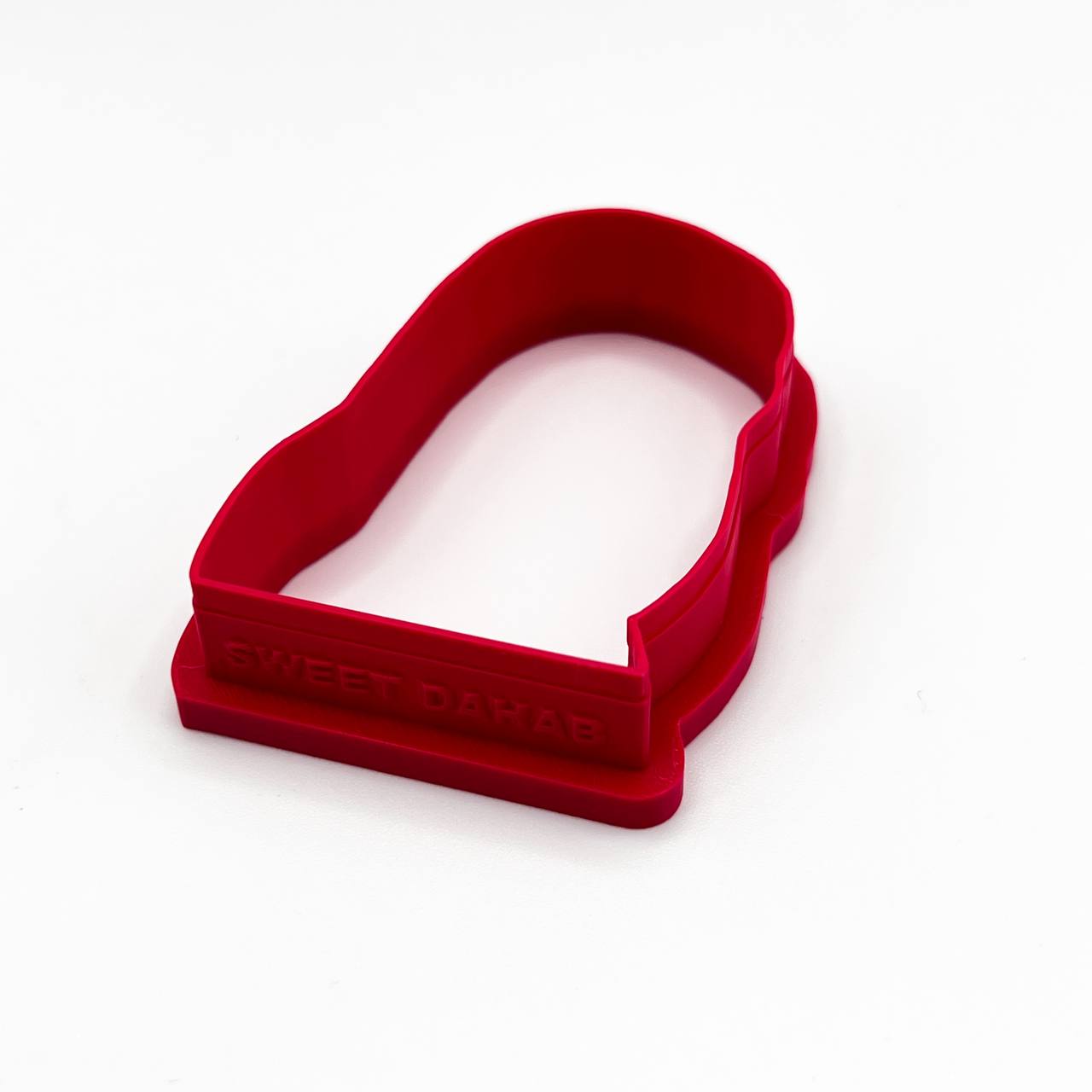 قطاعة كوكيز على شكل عروس جرتق مع صورة مماثلة